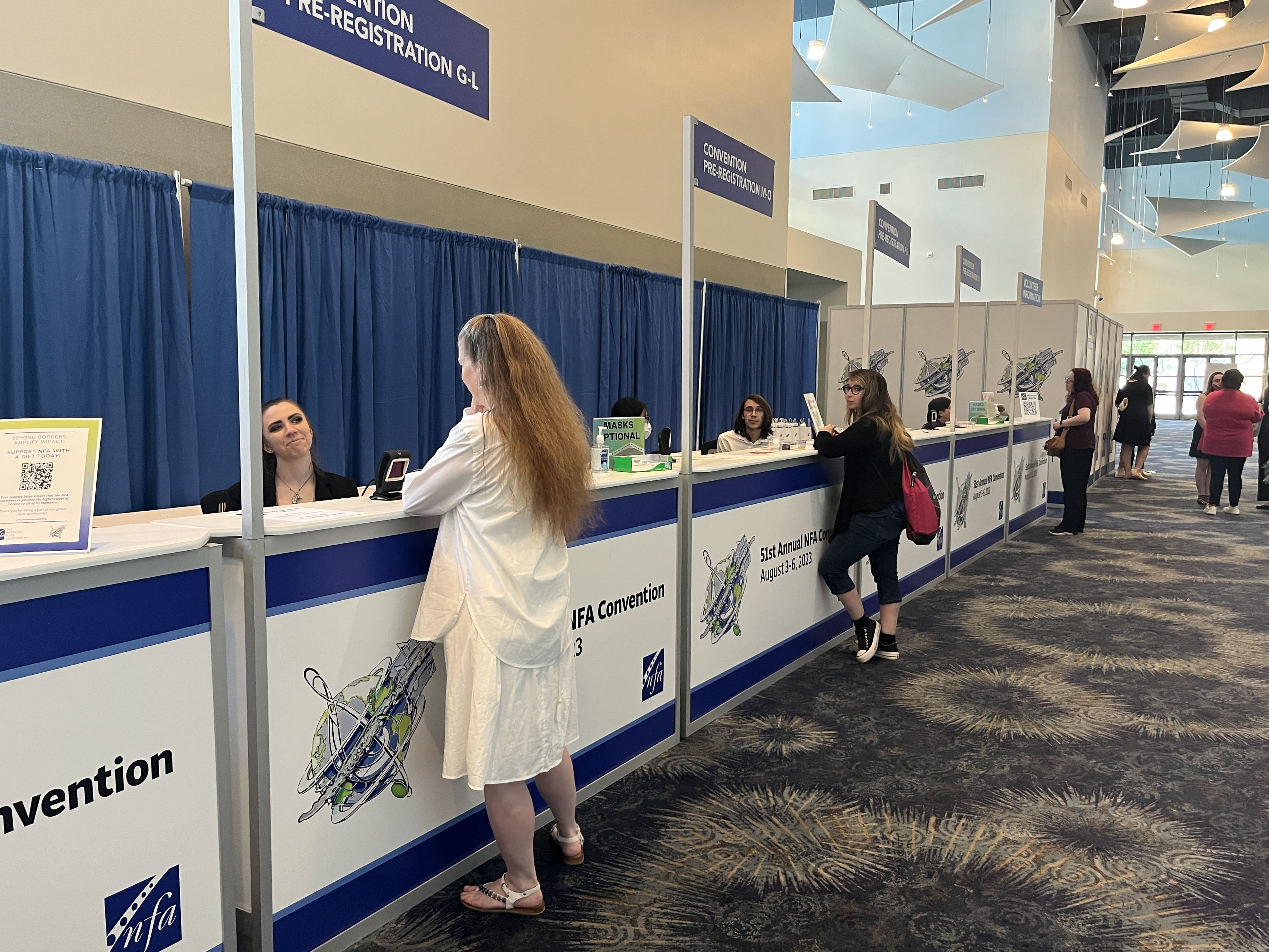 A busy registration desk at the 2023 NFA Convention